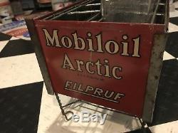 Mobil Oil Socony Arctic Filpruf Vacuum Oil Bottles WithOriginal vintage signs, rack