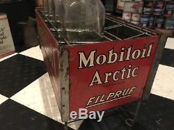 Mobil Oil Socony Arctic Filpruf Vacuum Oil Bottles WithOriginal vintage signs, rack
